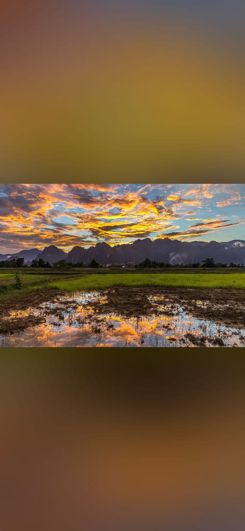 Colorful sky with orange clouds reflecting in the… wallpaper in charcoal and charcoal tones, Full HD, 4:3 format for phone