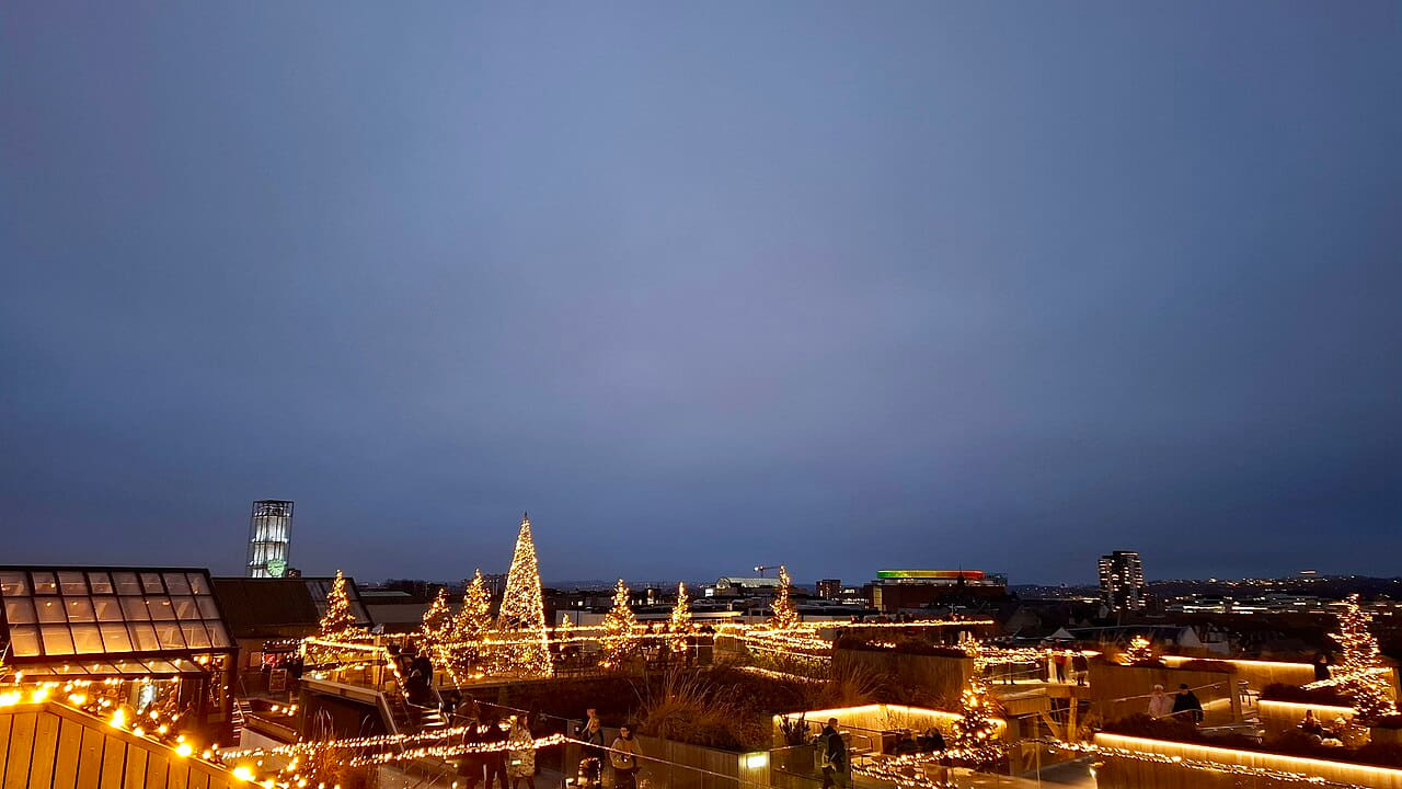 View with Christmas lights 2025 Salling Rooftop 01 wallpaper in slate and steel blue tones, Full HD, 16:9 format for phone
