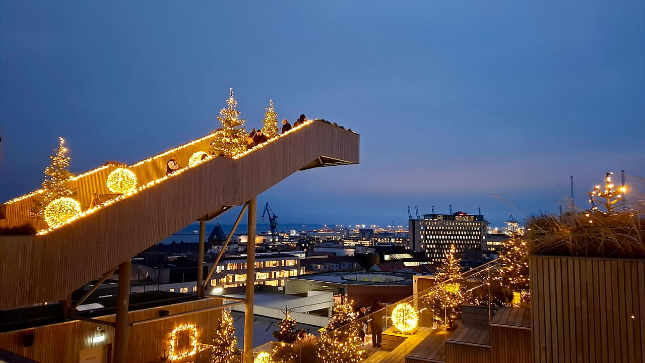 View with Christmas lights 2025 Salling Rooftop 02 wallpaper in steel blue and slate tones, Full HD, 16:9 format for phone